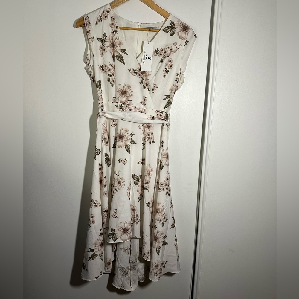 Women’s light floral spring dress with high low skirt, capped sleeves.